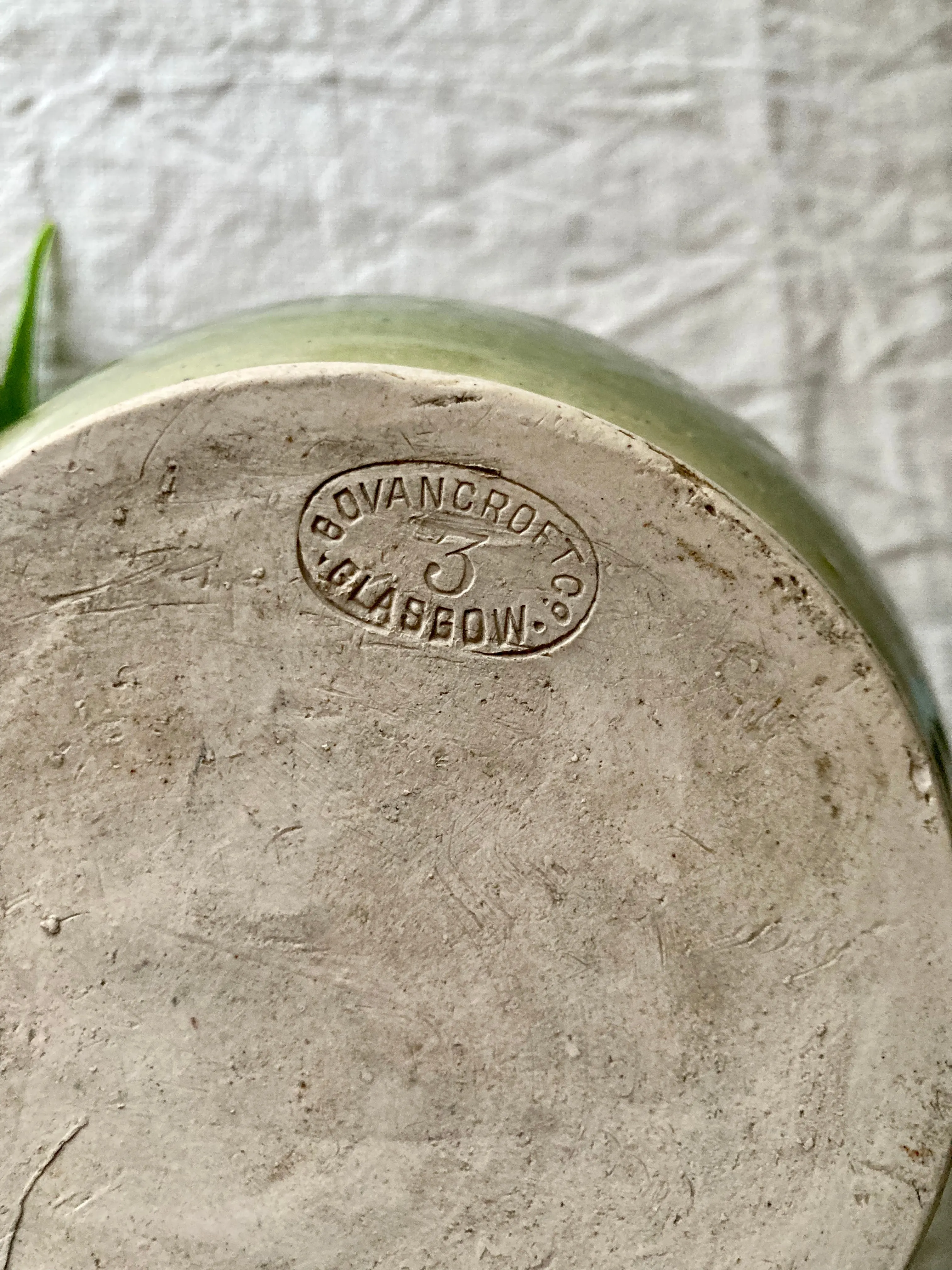Green glazed stoneware flagon or jug by Govancroft